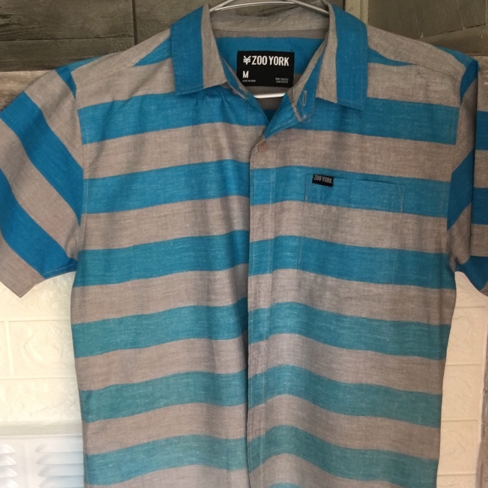 Blue and gray stripped button down boy’s shirt